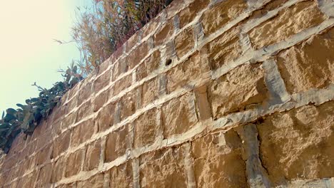 stone and clay wall in an old village in the middle of the desert with the style of arab house