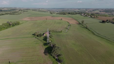 Aerial-view-of-lush-green-fields-and-countryside-in-Toulouse,-France,-sunny-day