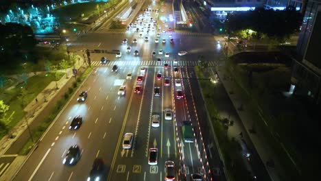 aerial view following street traffic in night time at hangzhou, zhejiang province, china