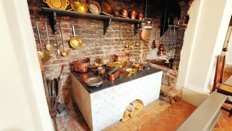 wide angle camera glides slowly into historic baroque kitchen, rustic cookware