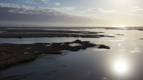 An-aerial-shot-over-Baldwin-Bay-near-Freeport,-NY-during-sunset