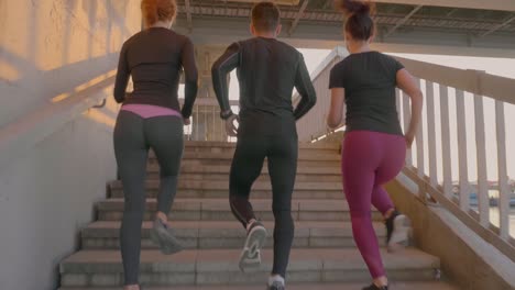 group of friends having fun running along together.