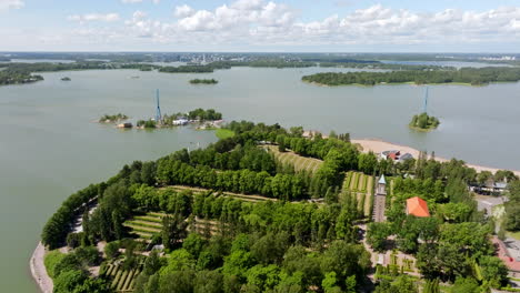 drone flyover the hietaniemi graveyard, sunny, summer day in helsinki, finland
