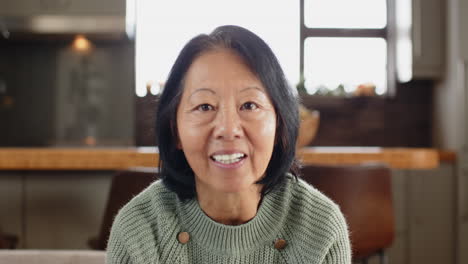 laughing joyfully, elderly woman celebrating christmas season at home with family