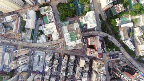 central hong kong, top down aerial view of traffic and city skyscrapers