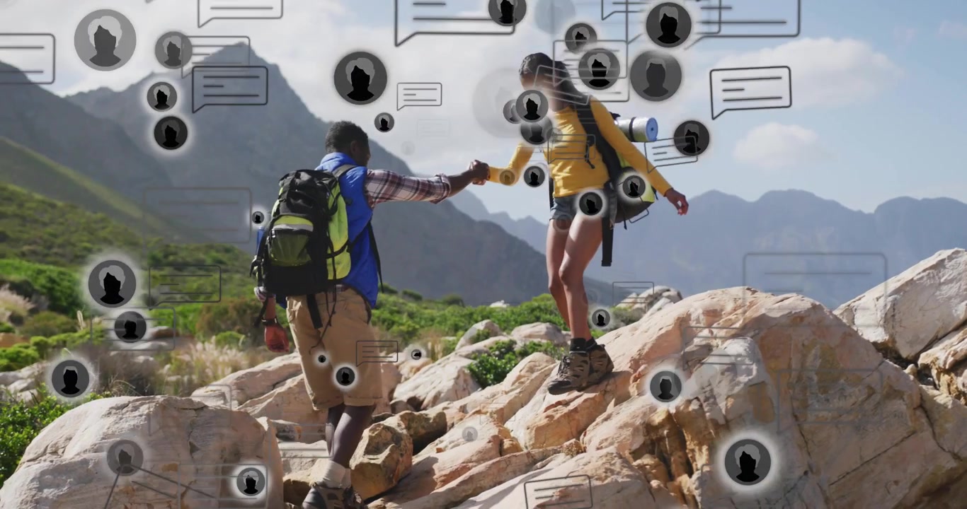 Pair man reaching, woman grasping stepping, man pulling, tech icons msgs obscuring helping navigate
