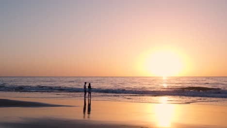 couple watching sunset on the beach