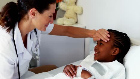 Female-doctor-examining-a-sick-girl