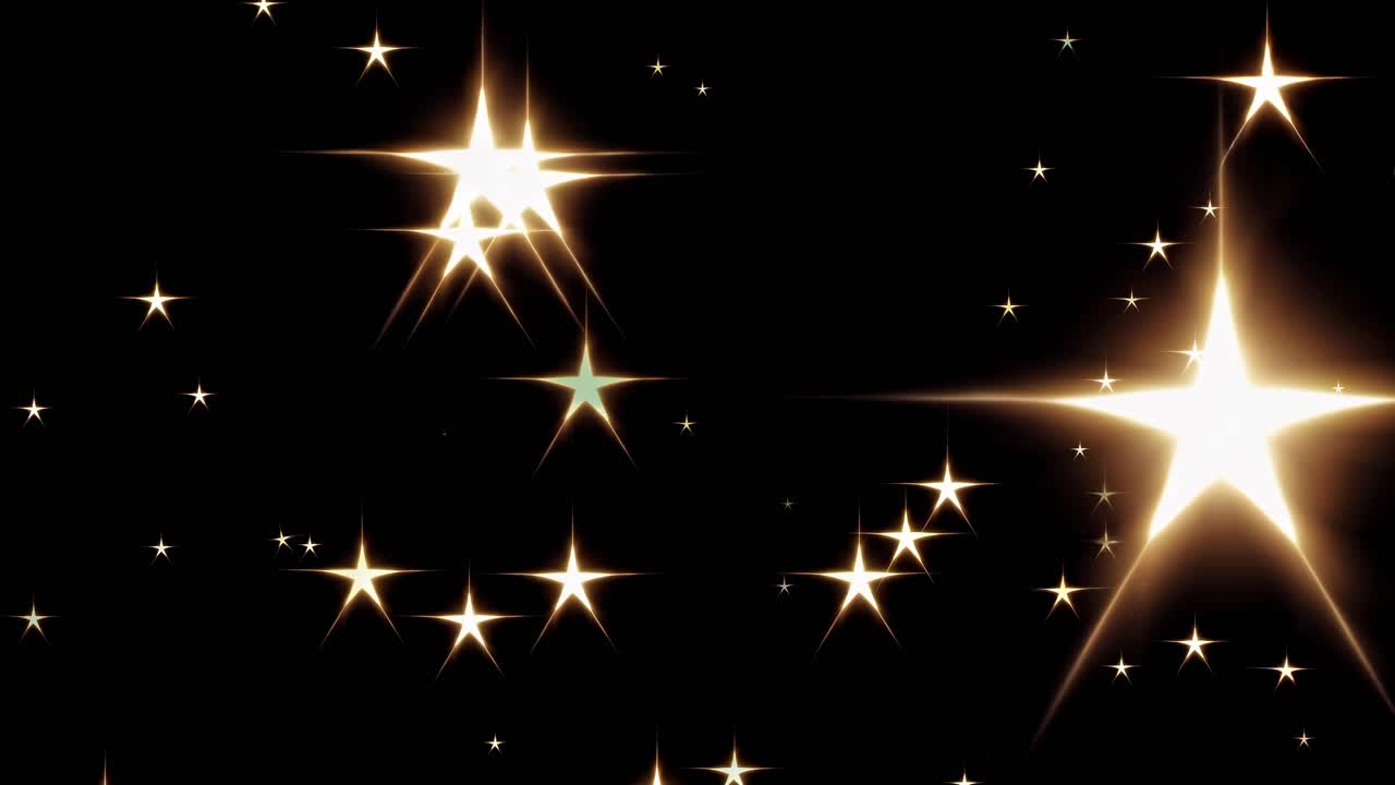 A video still of glowing stars scattered across a black background, captured from a straight-on