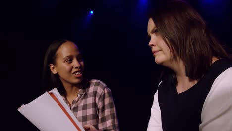 teenagers rehearsing in a theatre