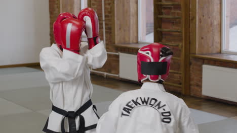 Two-athletes-fighting-indoors