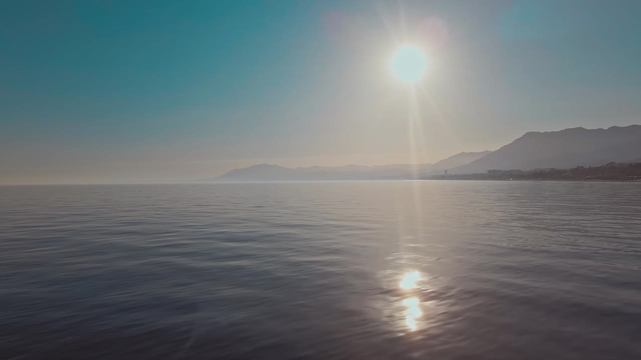 Sunset over the ocean with panning to the left