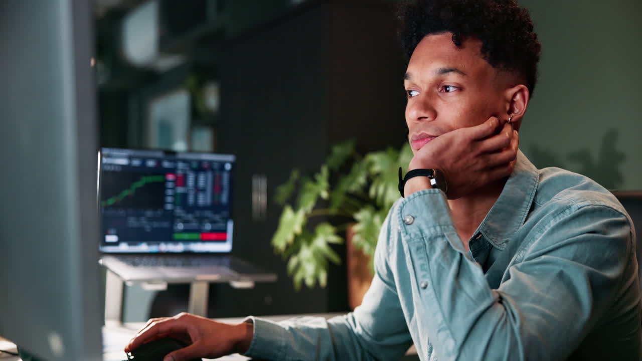 Focused Businessman Working Late on Computer in Office