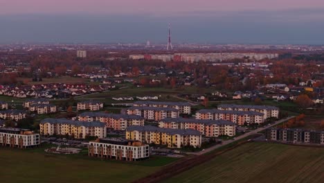 aerial view of riga suburb in latvia, capturing autumn colors and sunset glow.