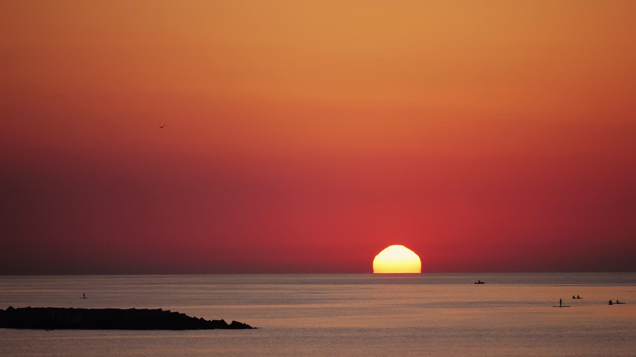Sunrise over the Ocean with People