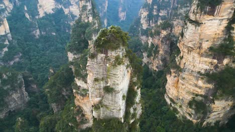 aerial orbiting shot of a rock column within zhangjiajie national park