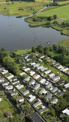 aerial view of a lakeside community with canal and recreational vehicles