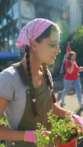 woman selling plants at a street market