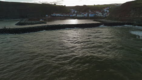 Low-Establishing-Drone-Shot-of-Staithes-Village-on-Sunny-Day-Yorkshire