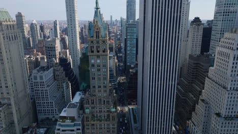 Aerial-view-of-various-high-rise-downtown-buildings.-Historic-tall-hotels-contracting-with-modern-office-skyscrapers.-Manhattan,-New-York-City,-USA