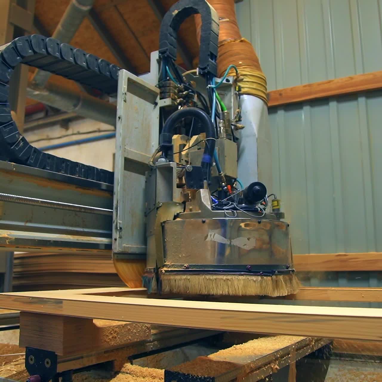 Equipment moves over the door billet, shavings fly aside. Machine-tool working on the present-day plant