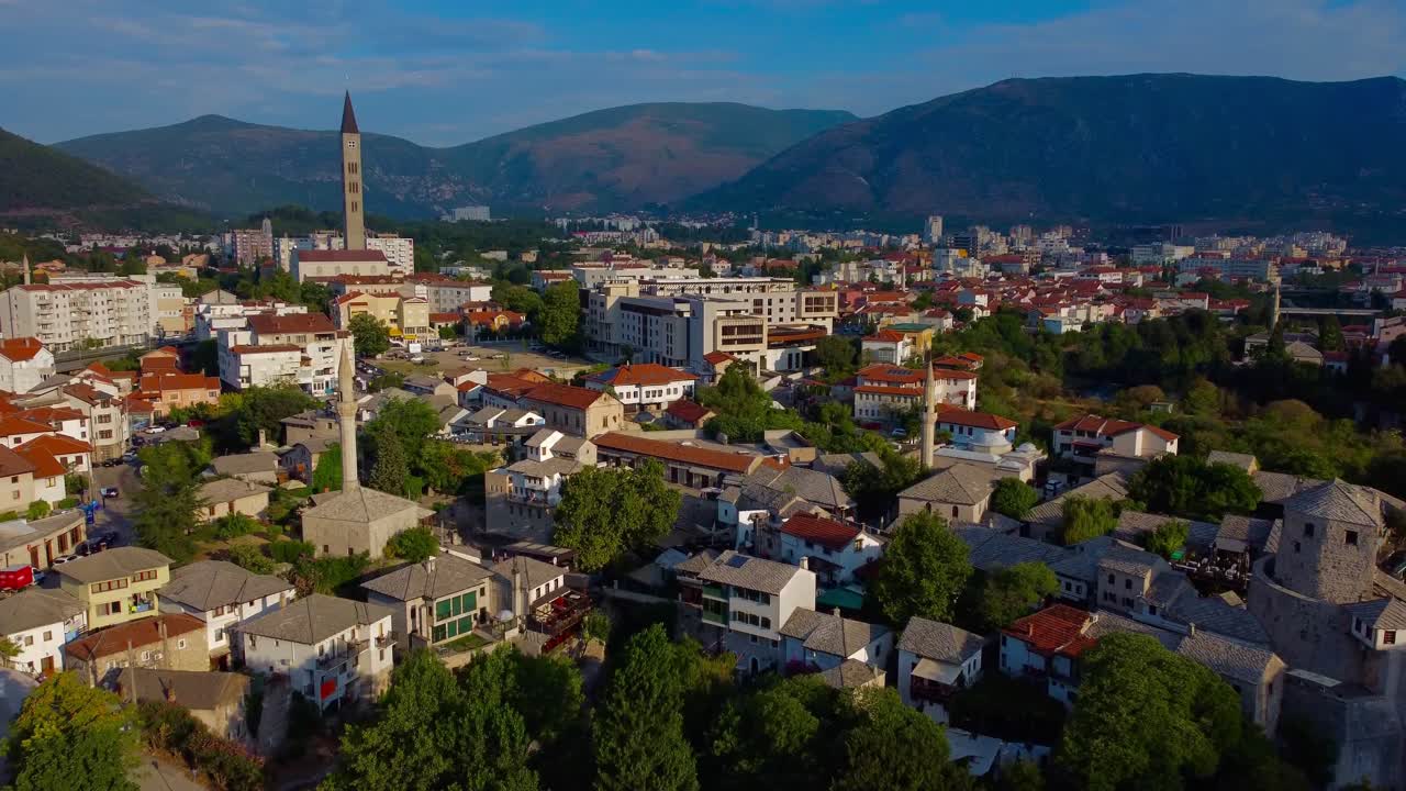 Mostar cityscape - aerial 4K drone video overlooking Mostar city with mountains in the background - Bosnia and Herzegovina