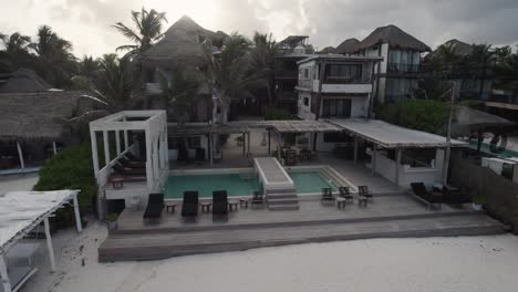 amansala resort in tulum, mexico with beachfront pool view - aerial