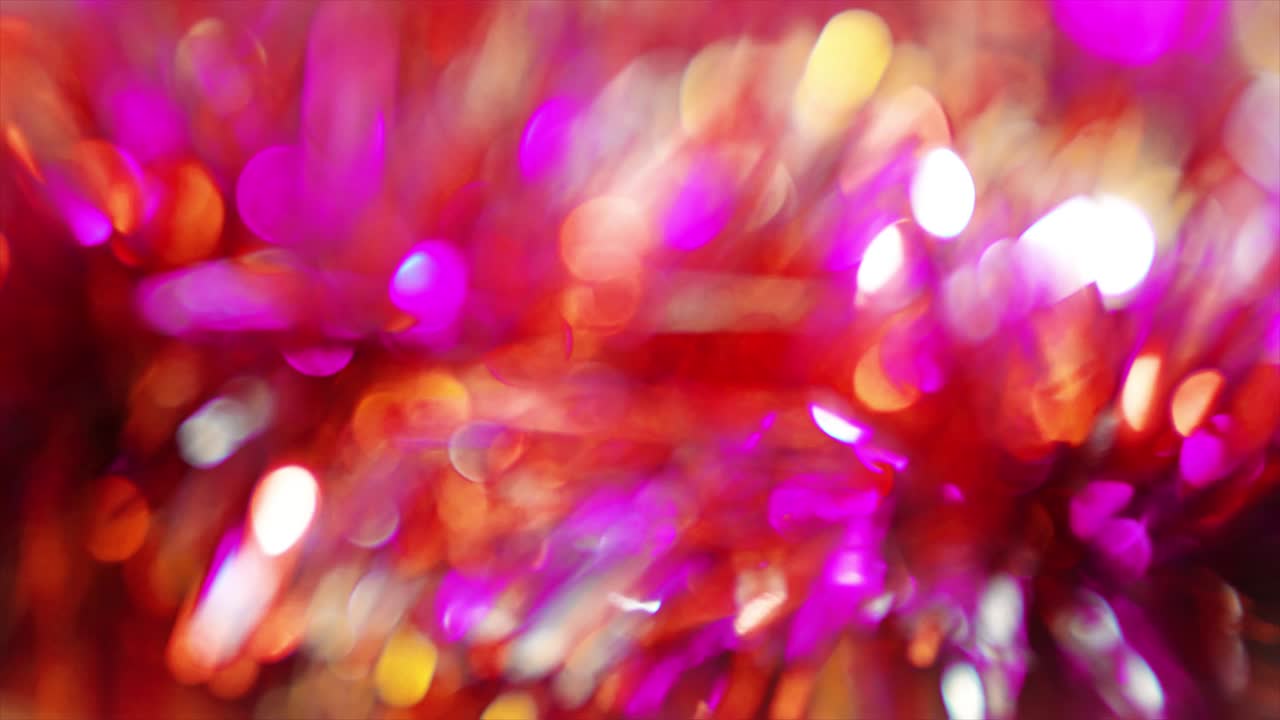 축제 장식: 빛나는 반점과 입자의 추상적인 배경