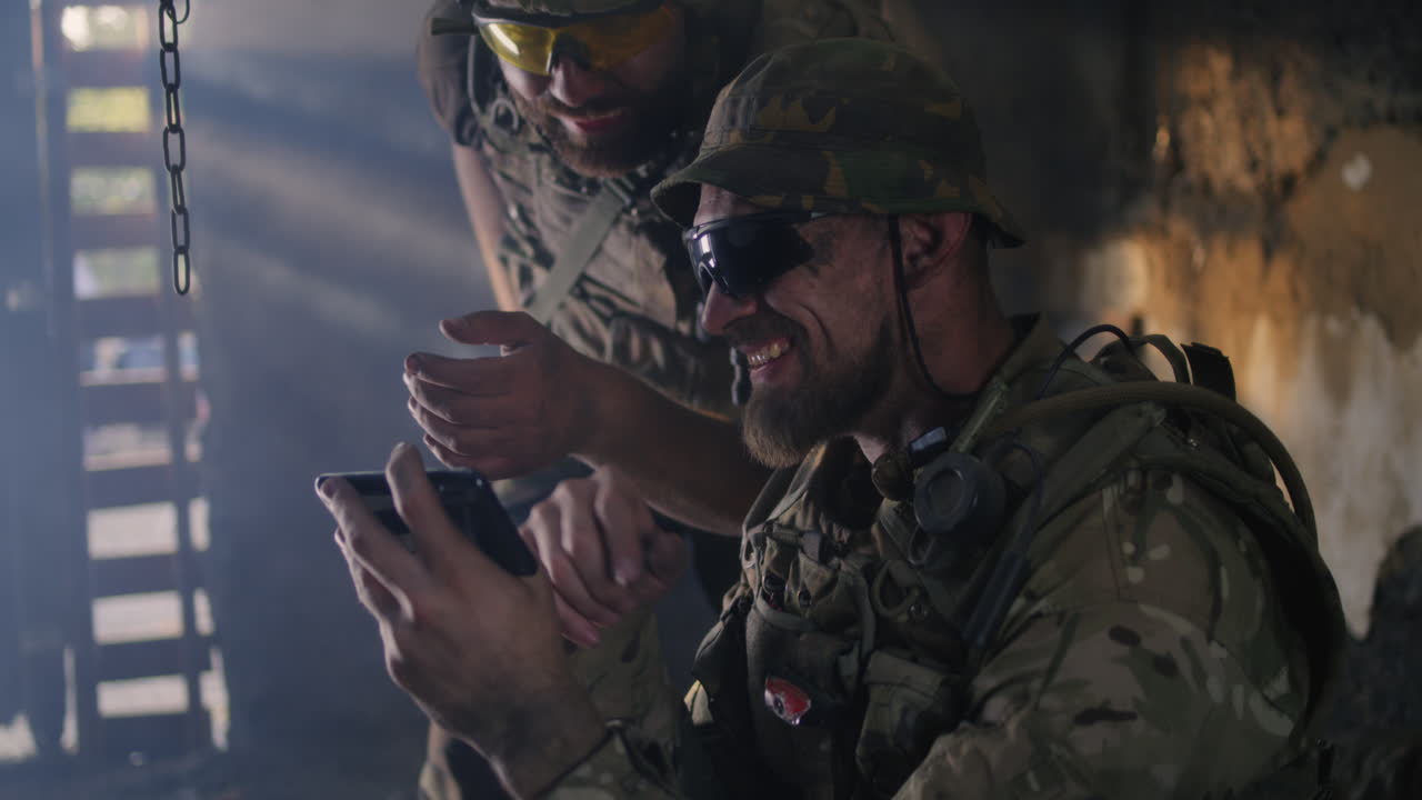 Military Personnel Using Smartphone in a Combat Zone