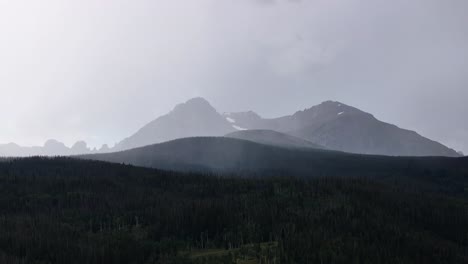 mazy mysterious view of a mountain range in the fog in silverthorne colorado aerial trucking