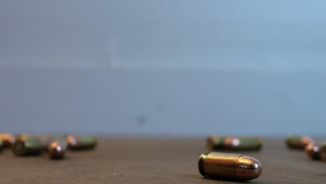 rolling handgun bullets rolling on the table
