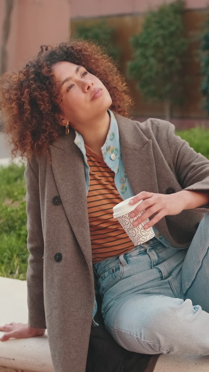 Young Woman Relaxing With Coffee Outdoors