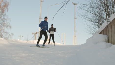 couple cross-country skiing in winter