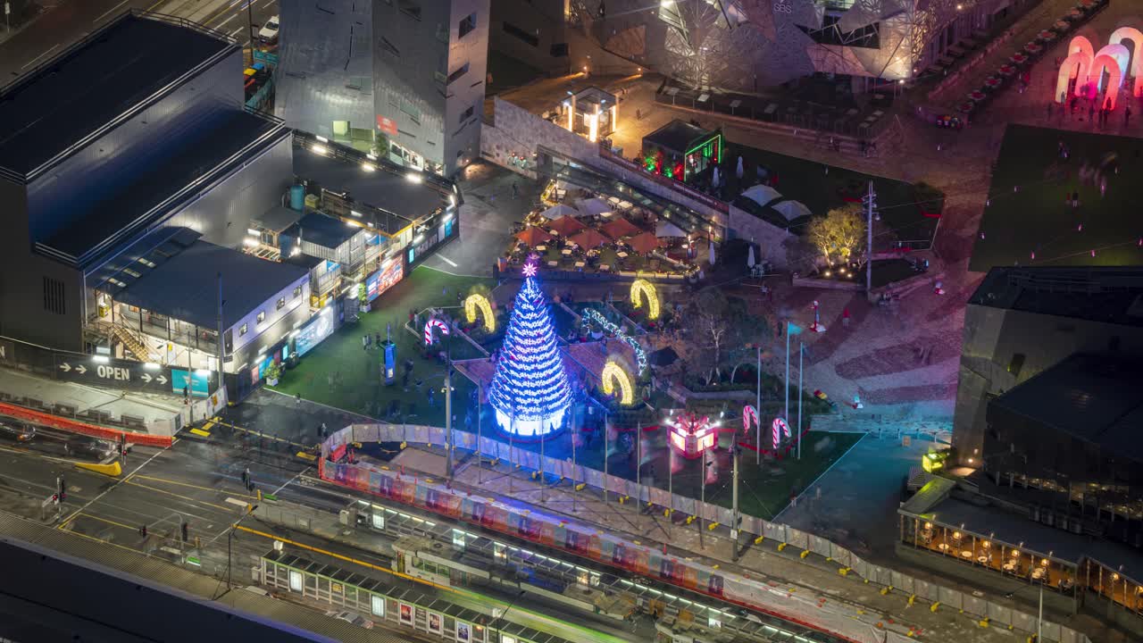 Time Lapse of Christmas Tree LED Light Installation at Federation Square next to Flinders Street Melbourne Victoria Australia, during Christmas Season 2020, footage taken from Eureka Tower.