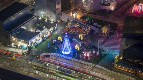 time lapse of christmas tree led light installation at federation square next to flinders street melbourne victoria australia, during christmas season 2020, footage taken from eureka tower.