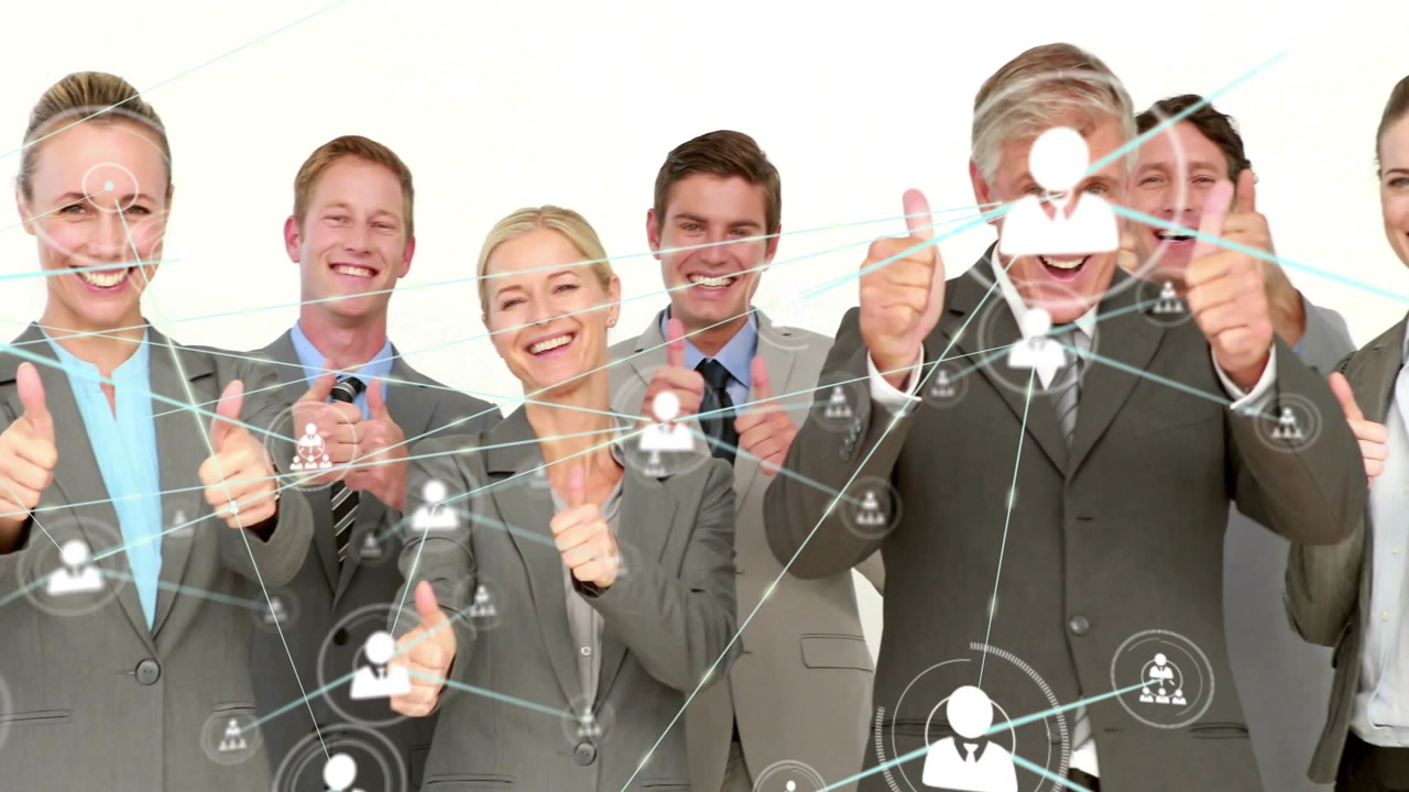 Standing team in suits holding thumbs-up on white backdrop as network overlay moving in for promo