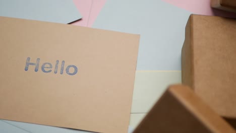 greeting card with hello message and envelopes