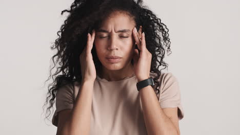 african american upset woman over white background.