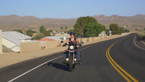 woman motorcyclist with dog