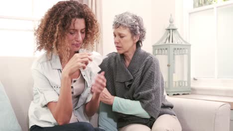 Woman-comforting-her-friend-crying