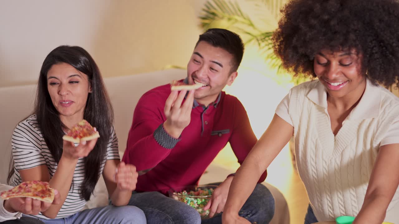 Friends Eating Pizza and Snacks at Home