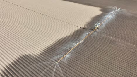 Irrigation overhead sprinkler machine spraying water