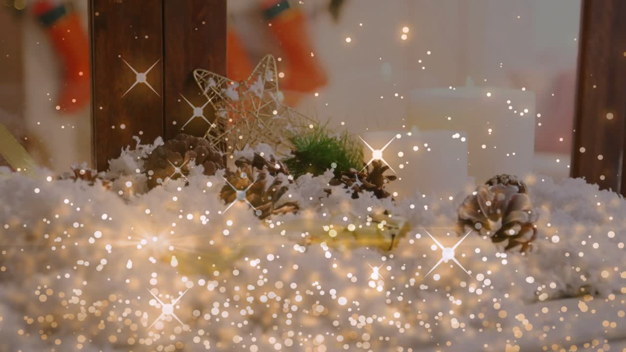 Camera shifting downward revealing cones, wire star, snow; gold glitter drifting, highlighting sill