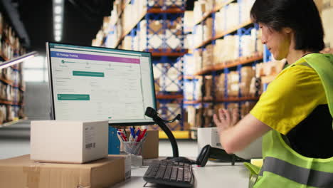 vertical video warehouse worker scanning airway bills labels applied on cargo packages