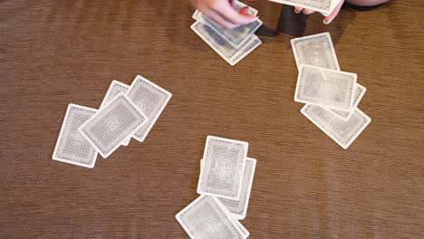 hands expertly shuffling a deck of playing cards