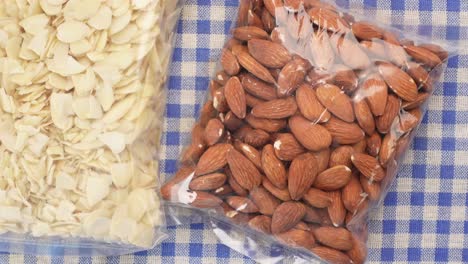 top view of almond nut and slice in a packet on table ,