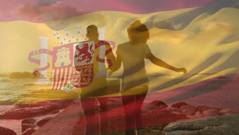 Animation-of-flag-of-spain-over-african-american-couple-at-beach