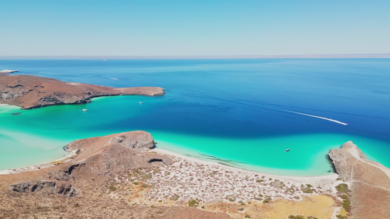 Tecolotito beach in la paz, showcasing clear turquoise waters and sandy shores, aerial view