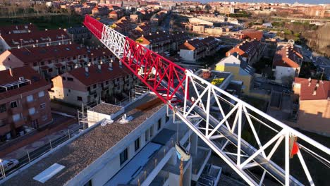 aerial overhead view of a crane over a city, drone shot