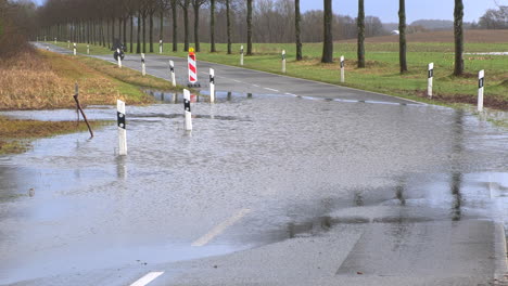 a country road is flooded after heavy rainfall